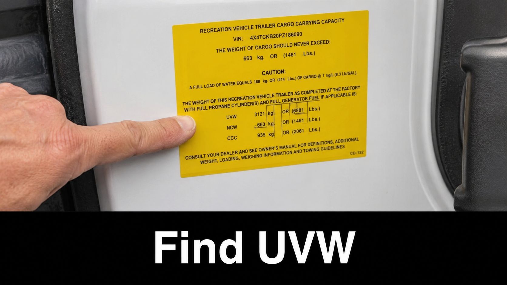 A close-up view of a yellow information label on an RV indicating the vehicle's unloaded vehicle weight.