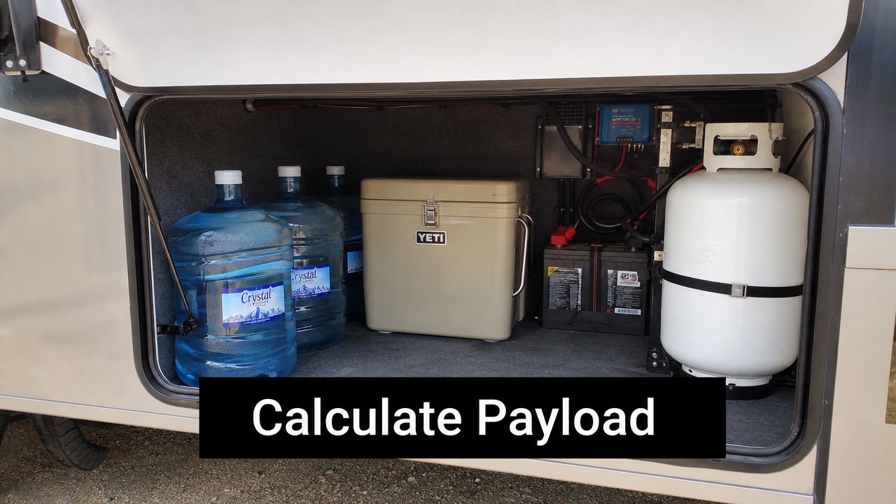 A storage compartment in an RV containing several large water jugs, a Yeti cooler, and a propane tank.