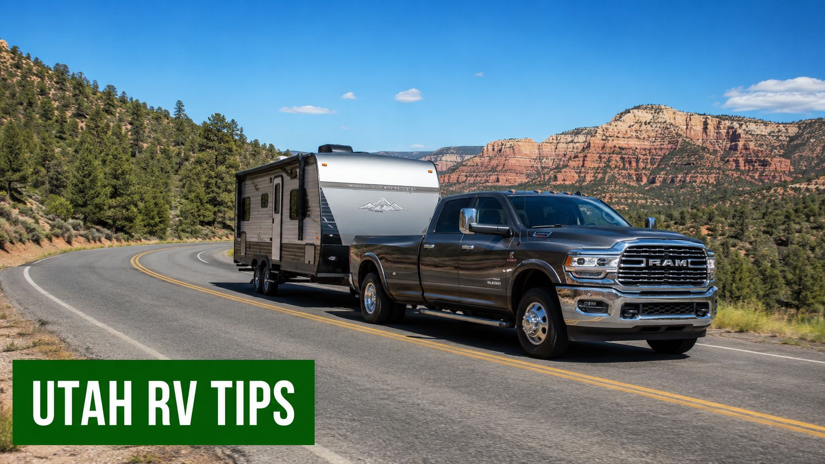A gray RAM heavy duty truck towing a silver travel trailer along a scenic desert mountain highway.