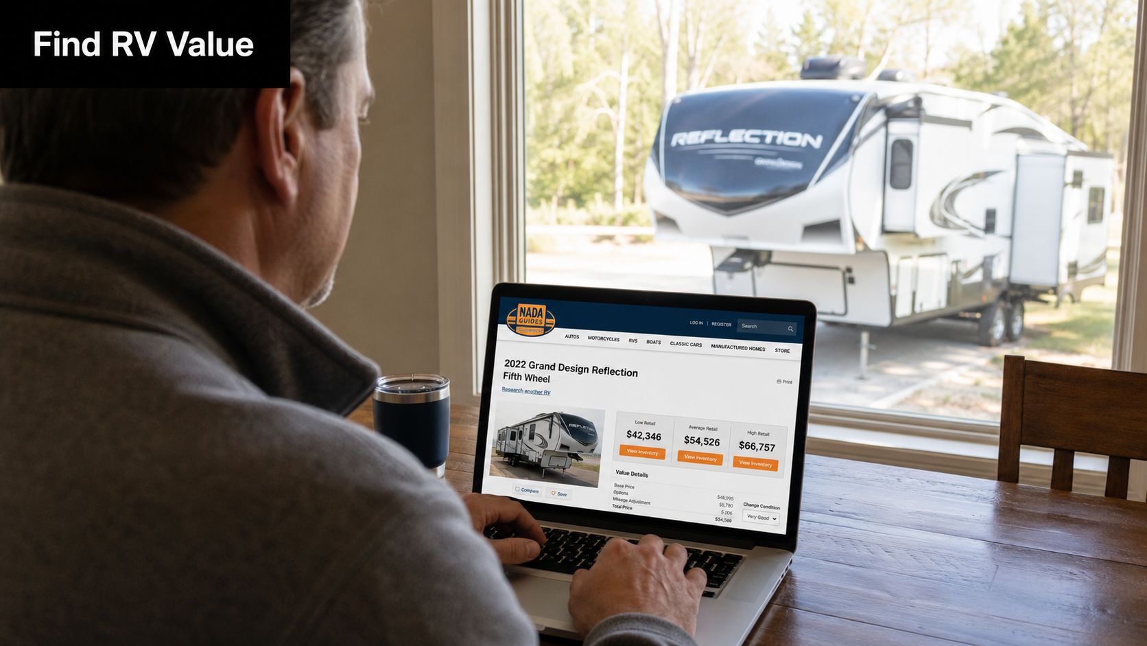 A man using a laptop to research used RV values on the NADA Guides website while sitting indoors.